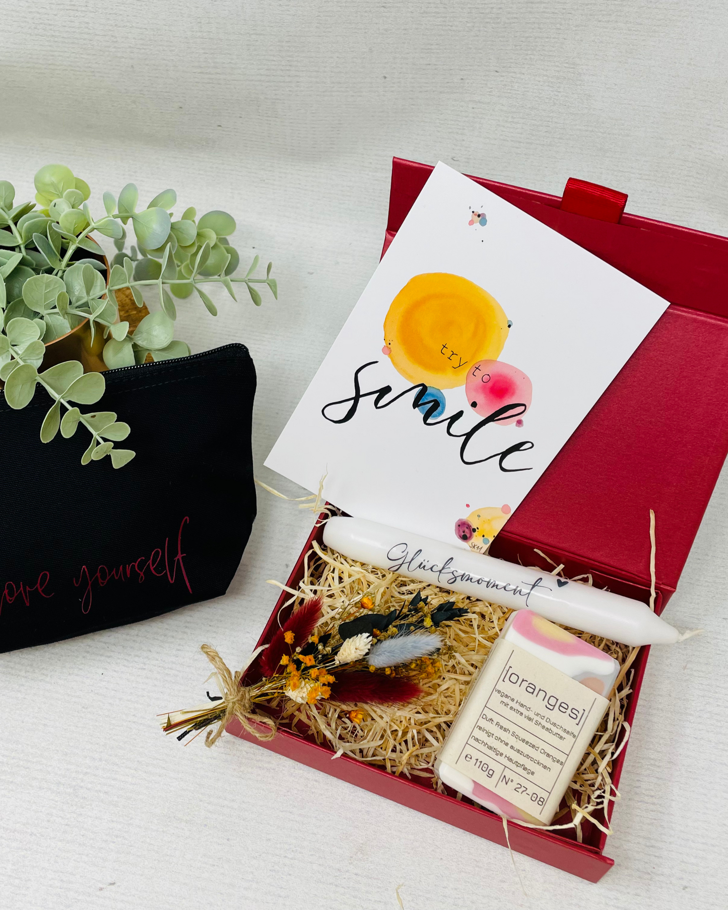 Glücksmomente erleben - mit Seife Oranges , Kerze und Kosmetiktasche - Geschenkbox im Set